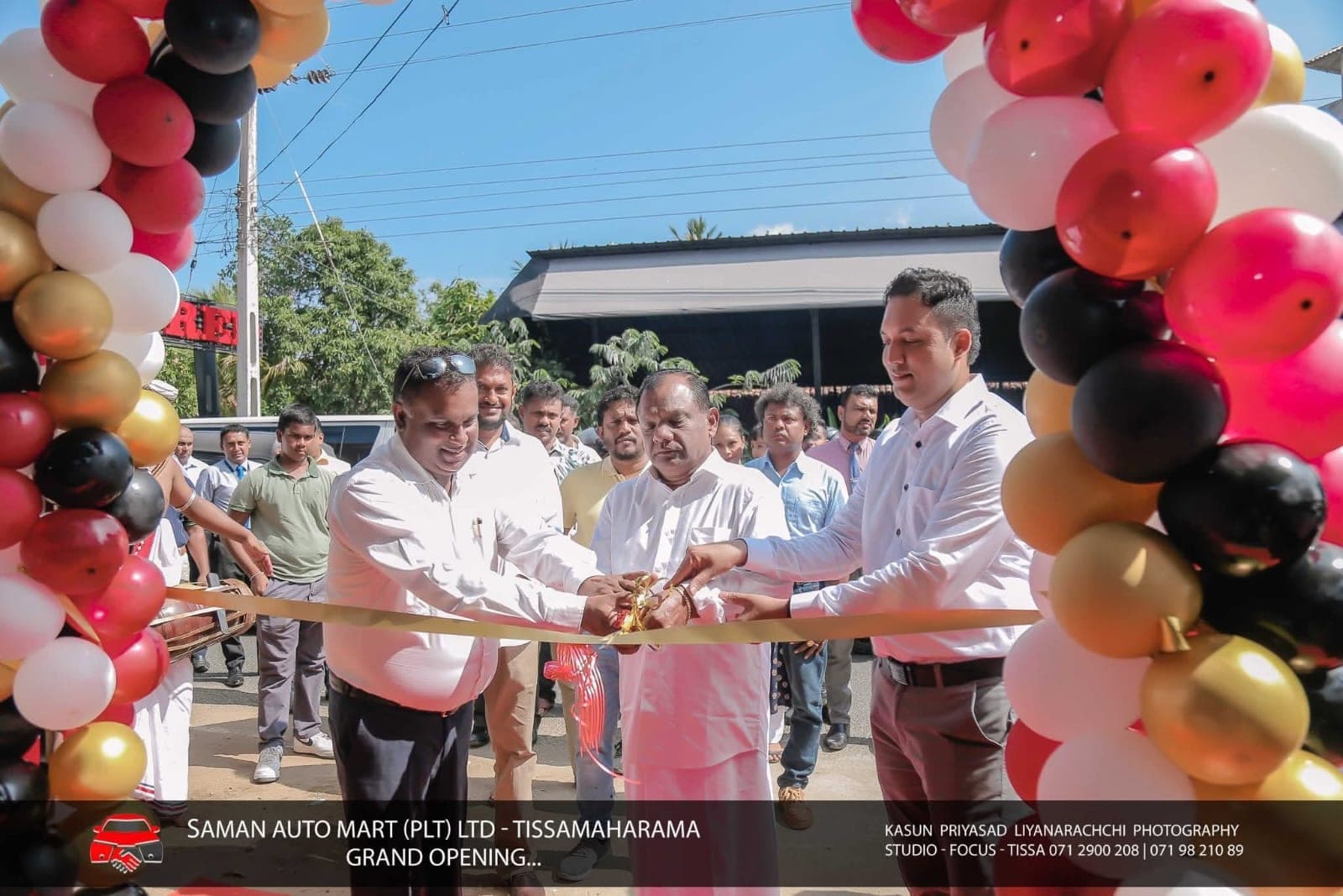 Balloons and crowd at the Saman Auto Mart grand opening celebration